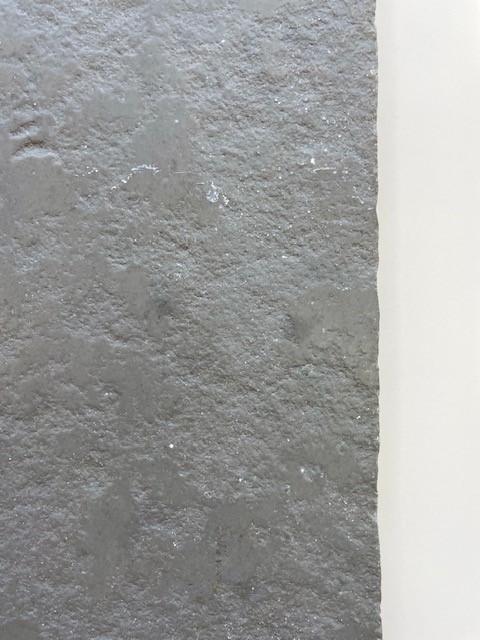 Close-up of Cathedral Grey limestone flooring surface with hand-cut edges and aged natural stone texture