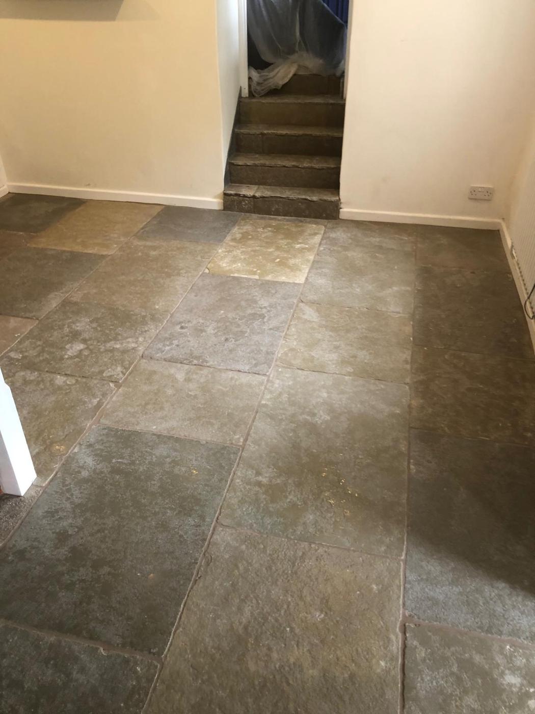 Cathedral limestone floor in a cottage living room in Teffont