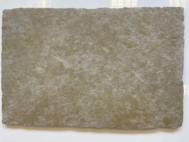Cathedral limestone flooring samples showing natural colour variation in olive green and brown tones