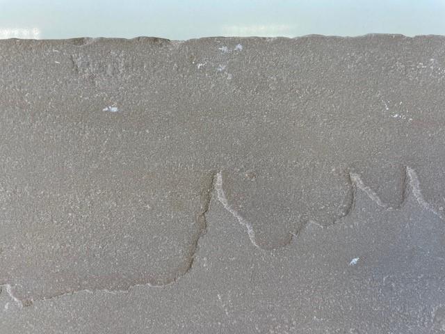 Desert Olive limestone flooring in random length layout showing mixed stone sizes and textured finish