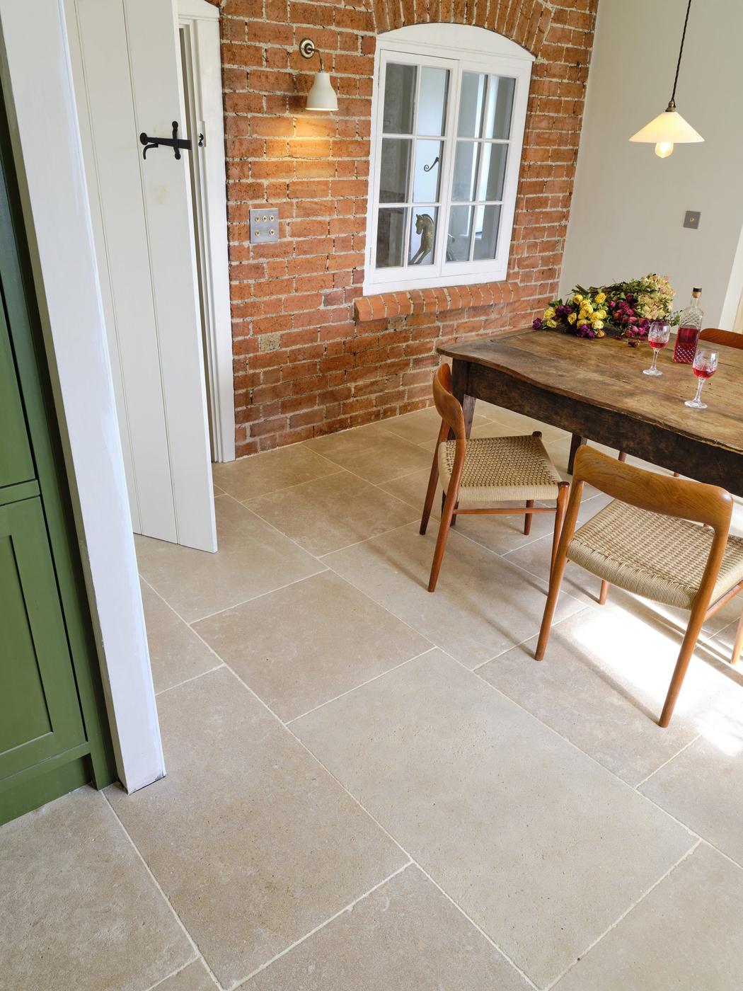 Epsom limestone floor viewed from above showing doorway transition and flagstone layout
