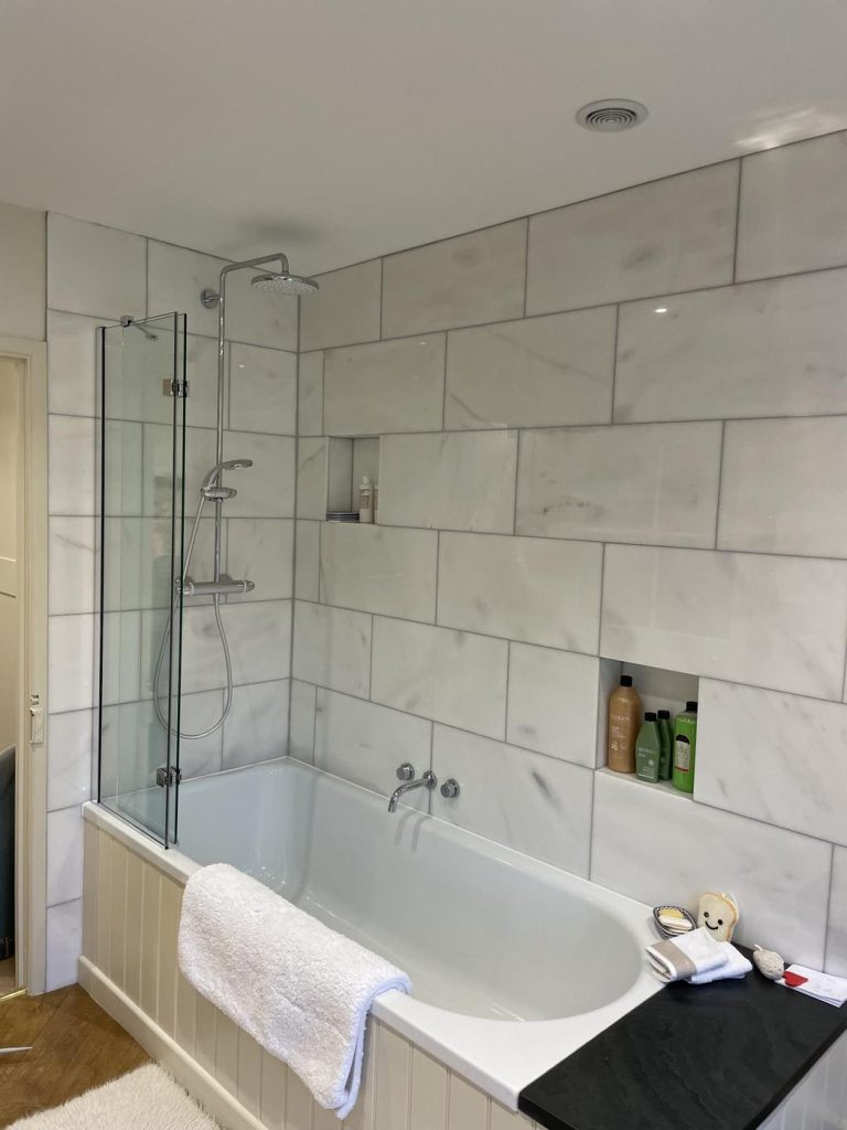 Marble stone floor and wall tiles in a shower