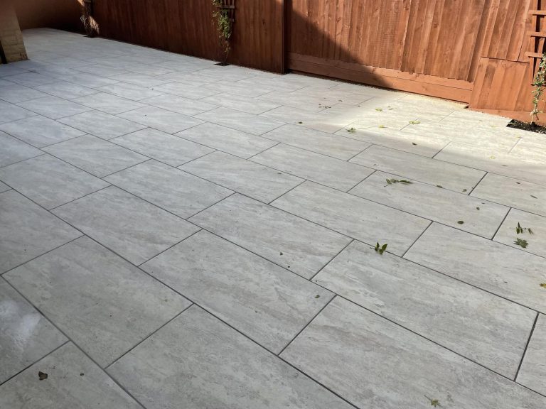 Large outdoor porcelain patio tiles installed in Dorset garden patio area