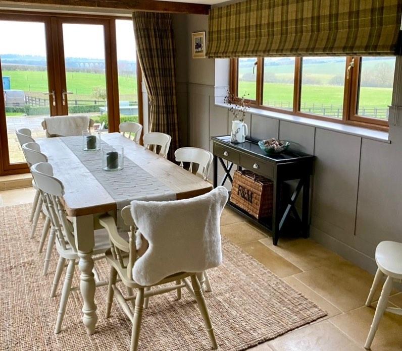 Worcester limestone kitchen floor installation showing a dining room table and chairs